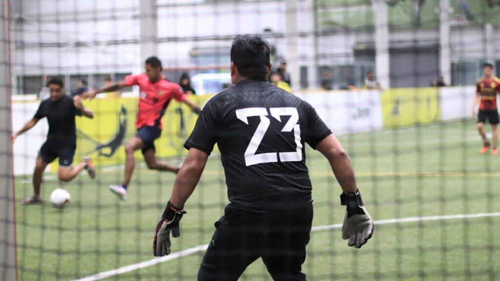 Seattle Tacoma adult soccer league match with the goalkeeper on guard.