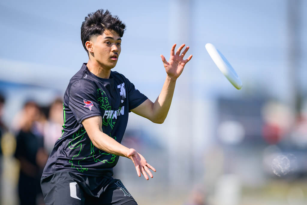 Ultimate Frisbee players running a play at a Tacoma field